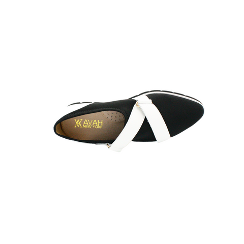 black lycra fabric crossed with white slip-on shoes